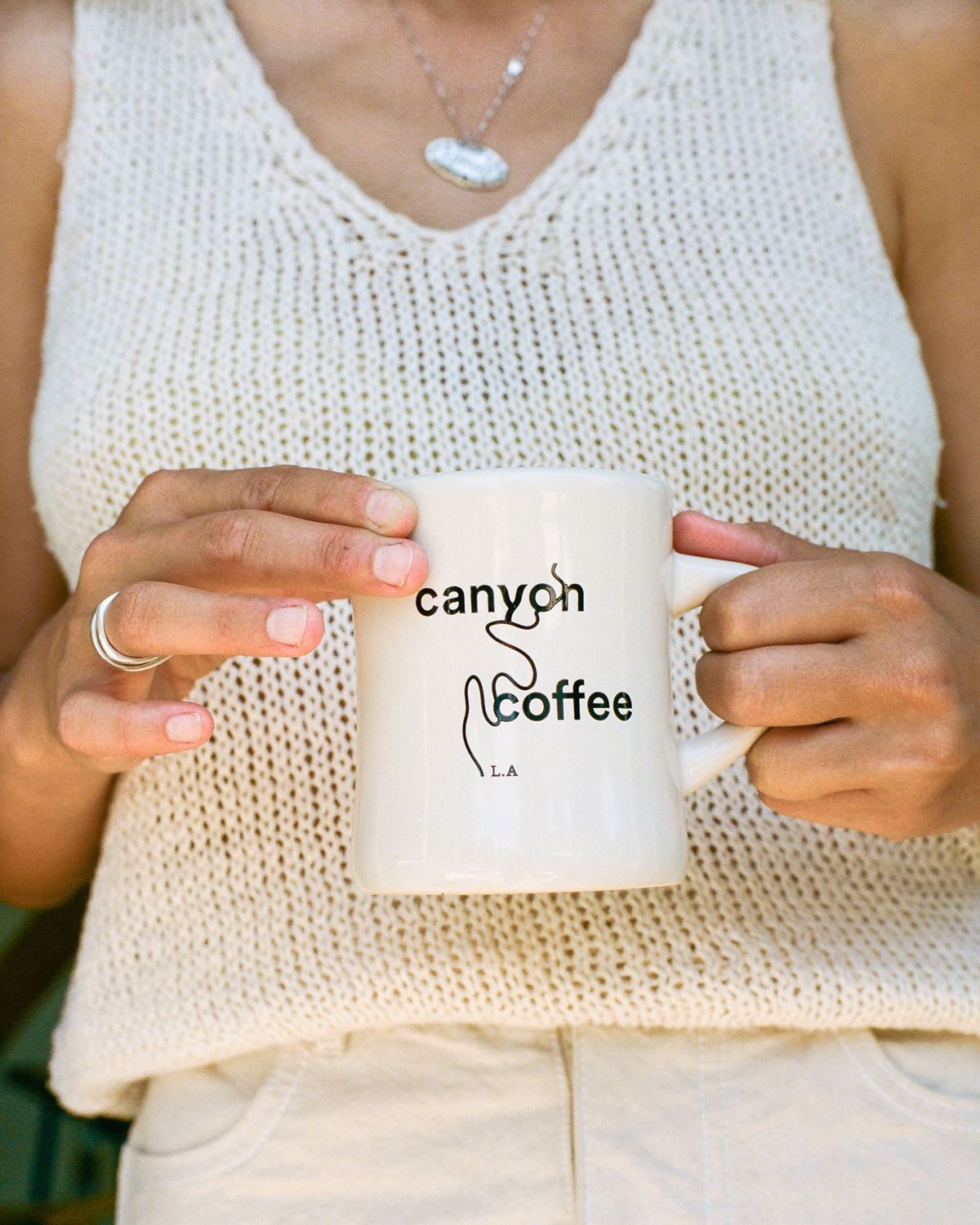 A cream classic diner mug with Canyon Coffee logo