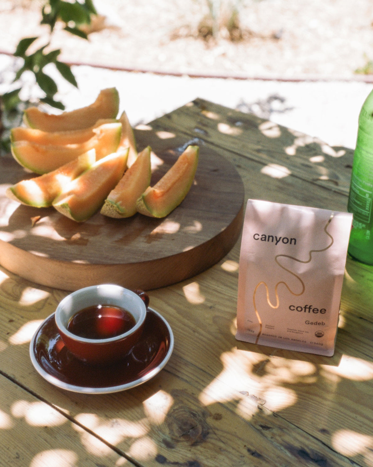 A bag of Gedeb Whole Bean coffee by Canyon Coffee with gold foil