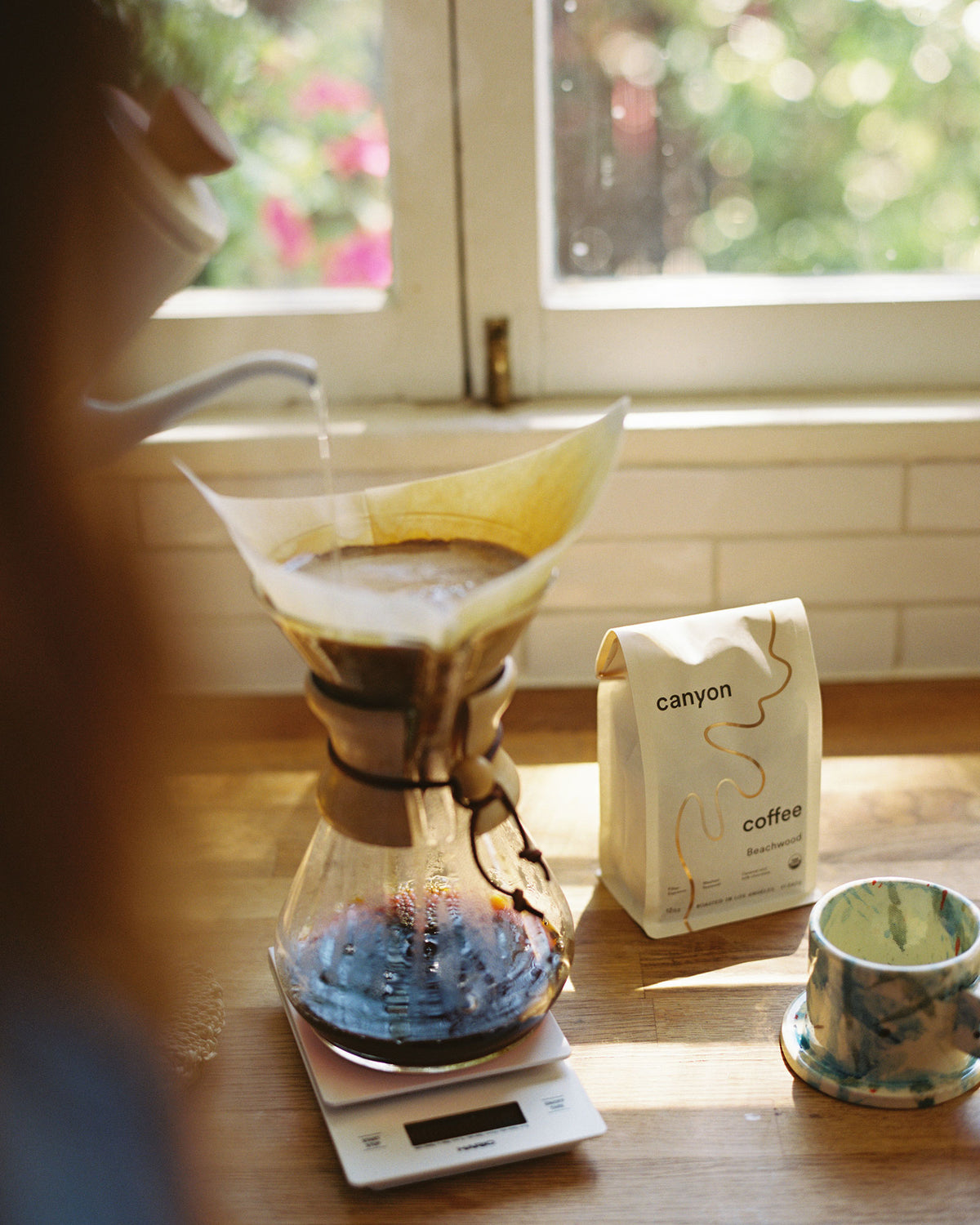 White coffee and kitchen scale by Hario with a chemex at home